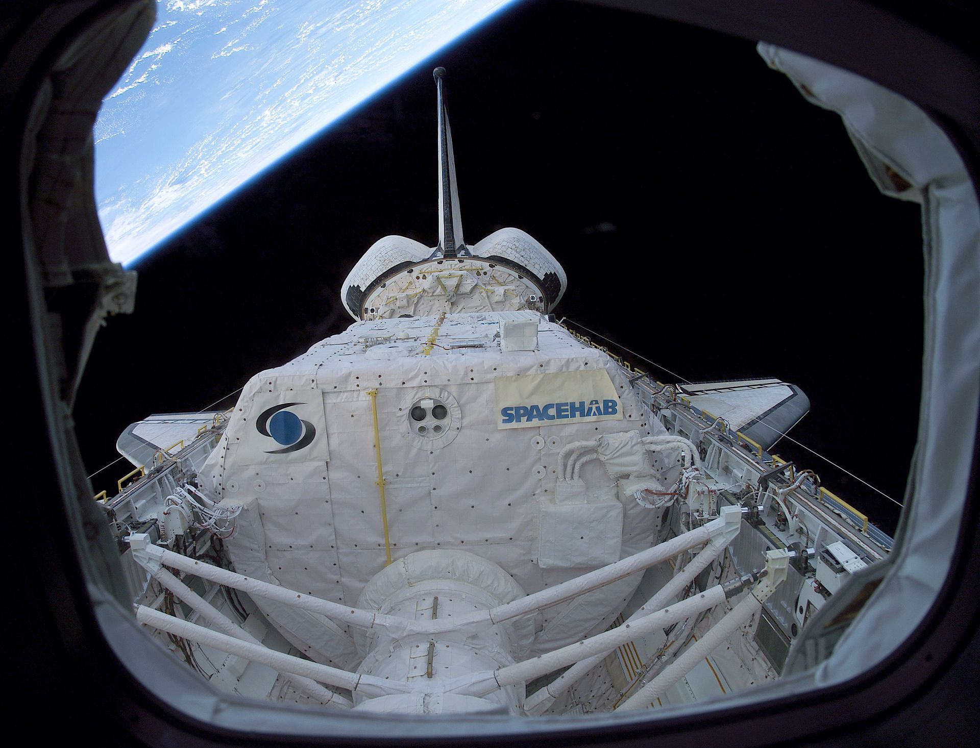 Image from Space Shuttle showing SpaceHab logo from space
Photo: Nasa